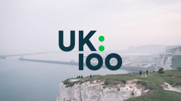 UK100 Logo with coastal background