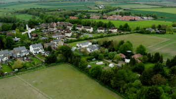 Aerial view of the village of Swaffham Prior in Cambridgeshire surrounded by green fields