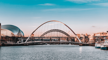 The Gateshead Millennium Bridge over the River Tyne in Newcastle at dusk