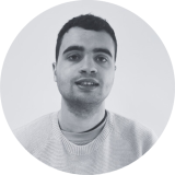 A grayscale portrait photo of Daniel Grieve, UK100 Membership Projects Officer